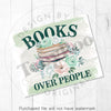 a sign that reads books over people